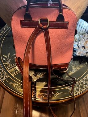 Dooney & Bourke Pink Leather Backpack with Brown Trim and Gold Hardware